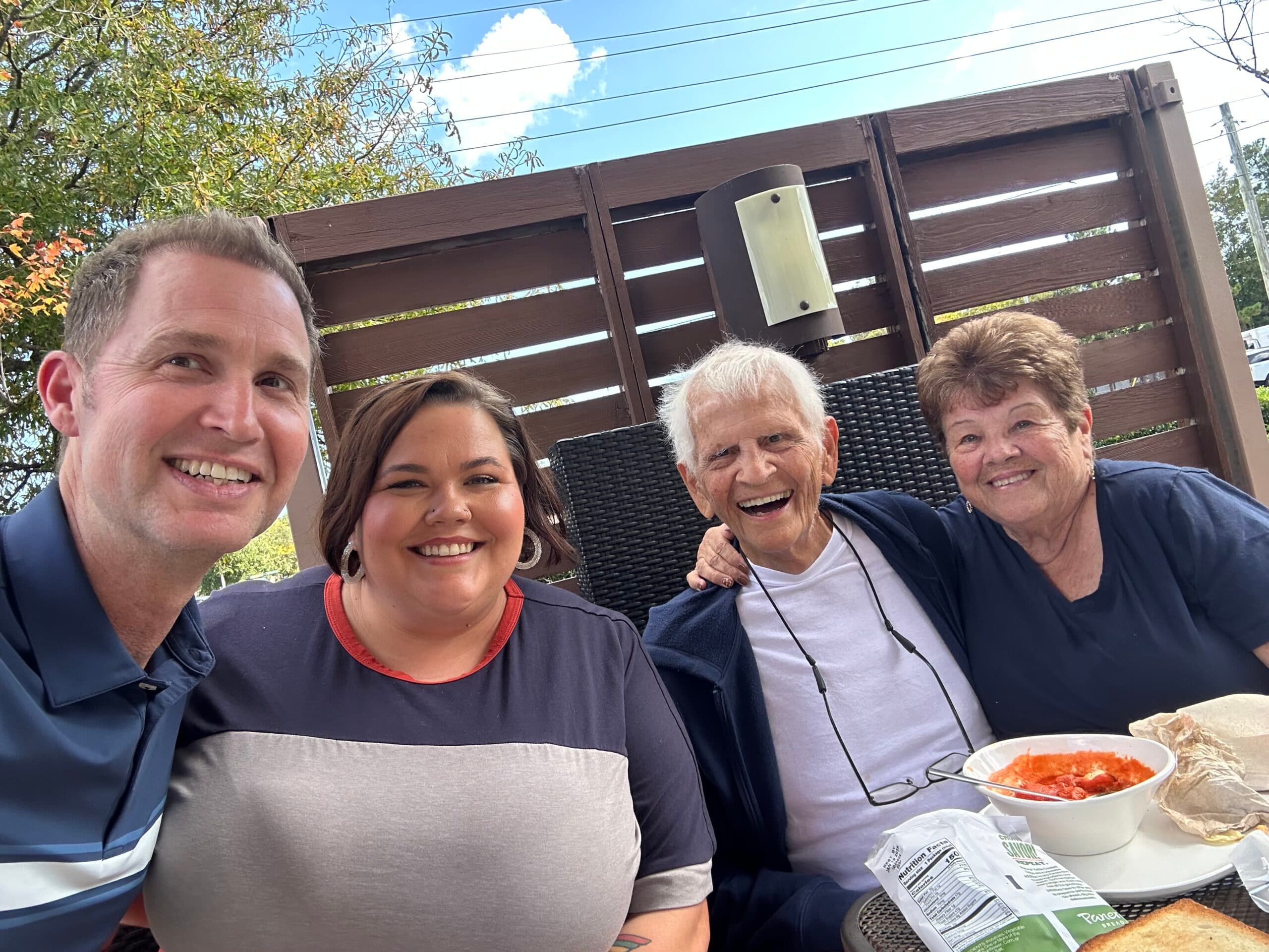 A multigenerational Roanoke family sharing a meal outdoors